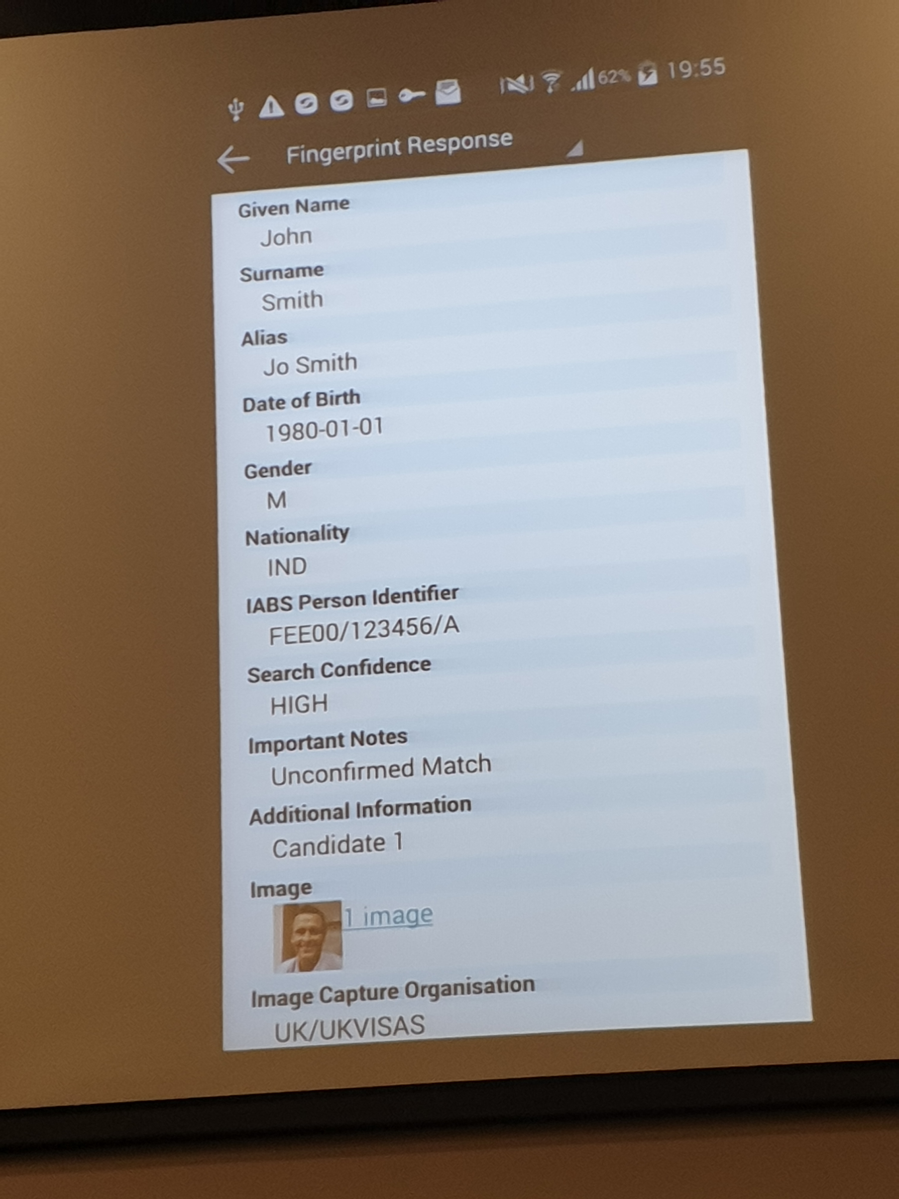 A sample search result, bringing back the person's names, Date of Birth, gender, Nationality, IBAS Person Identifier number, a search confidence level, notes and an image of the person.